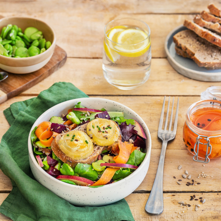 Vegetarian salad of warm goat cheese, carrot, beets and fava beans