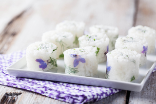 White rolls with fresh goat cheese and herbs